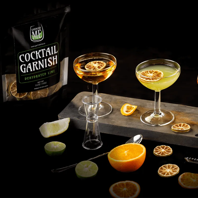 Cocktails garnished with dried lime and orange slices